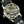 Load image into Gallery viewer, Close-up of a mechanical watch with visible brand name on a dark background